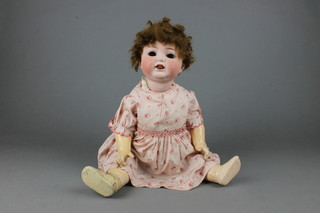 Heubach KÃ¶ppelsdorf, a porcelain headed doll with open eyes (f), 2 teeth and moving tongue, head incised Heubach KÃ¶ppelsdorf 342.6 Germany with articulated limbs 21" together with a small quantity of dolls clothing 