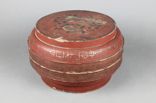 A 19th Century circular Chinese red lacquered box and cover, the lid with floral decoration, the interior with signature 8"h x 12 1/2"diam. 