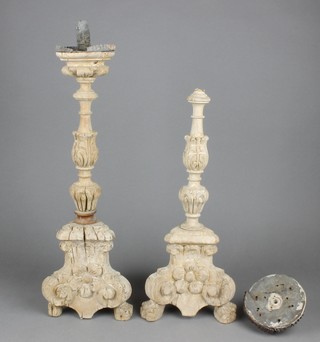 A pair of 17th/18th Century carved lime wood candlesticks 19" 