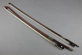 A K & H double bass bow together with a violin bow with "silver" mounts  