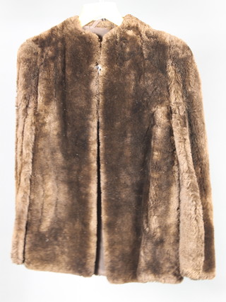 A lady's brown beaver lamb coat 