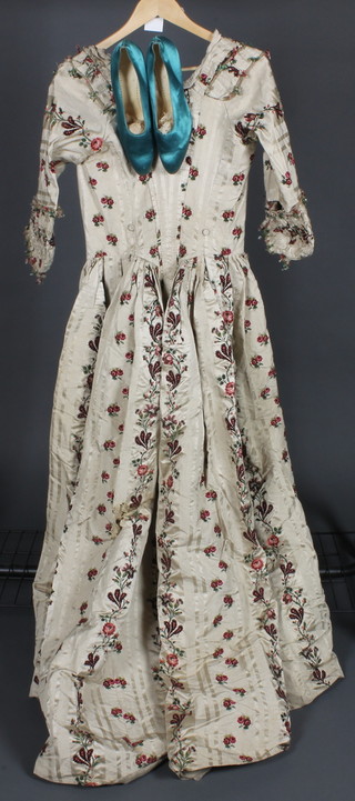 A lady's 18th/19th Century full length printed and embroidered silk dress, some holes and damage, together with a pair of lady's green silk shoes by Freeman Hardy & Willis