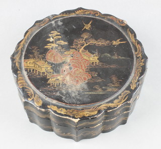 A 19th Century circular Chinese black lacquered trinket box decorated pavilions, the interior fitted 10 smaller trinket boxes 3 1/2"h x 9" diam. 