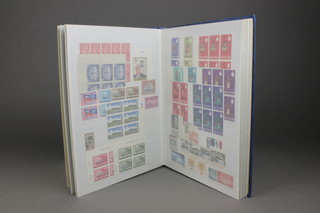 A blue stock of various world stamps