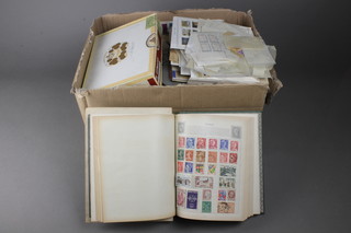 A tin of German stamps, a cigar box of used German and other stamps 