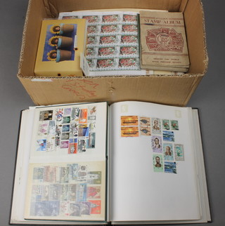 A quantity of loose stamps, albums etc 