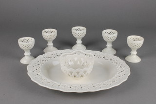 A Leedsware classical cream ware dish with pierced decoration, 5 egg cups and a ditto basket 