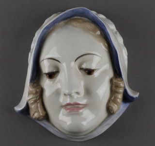 An Art Deco Continental porcelain wall mask in the form of a lady wearing a bonnet 8" 
