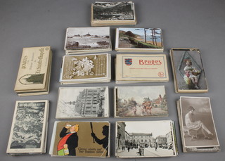 A large collection of black and white and coloured postcards