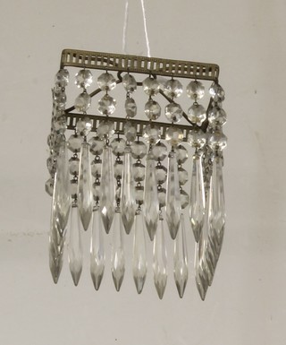 A square glass light shade hung lozenges 