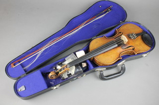 A 19th Century 2 piece back violin "Woln Bros Violin Manufactures Class 2 1891" 11171891, with nickel mounted bow, cased 