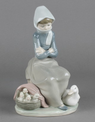 A Lladro figure of a seated goose girl 8 1/2" 