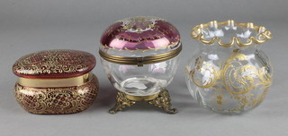 A 19th Century Continental gilt decorated ovoid glass pot with gilt metal mounts 4", a rounded rectangular cranberry ditto and a fluted necked vase 