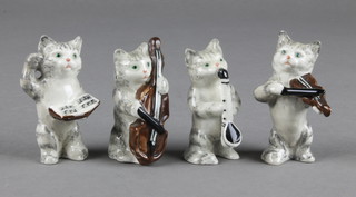 A Beswick cat band comprising a conductor, an oboe player, a saxophonist and a violinist 2" 