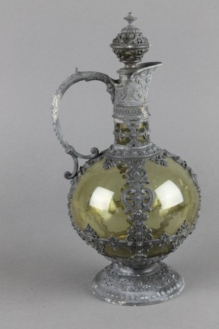 A 19th Century Continental spherical glass ewer with repousse pewter mounts 10" 