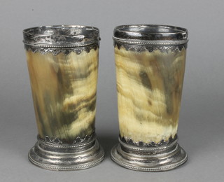 A pair of Georgian silver mounted horn beakers with lappet and beaded decoration, London 1817 