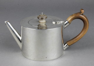 A George III silver cylindrical teapot of plain form with fruitwood mounts.  London 1797, gross 306 grams