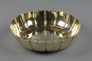 A George IV silver gilt dish with chased scroll cartouche, London 1824, 248 grams