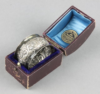 A Victorian cased repousse silver napkin ring Birmingham 1896 