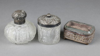 A repousse silver mounted glass toilet jar and a ditto bottle with a trinket box.