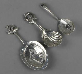 A silver bright cut caddy spoon and 2 others, 60 grams