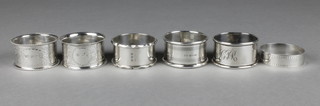 An Edwardian silver napkin ring and 6 others, 106 grams
