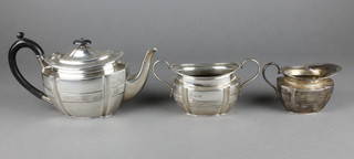 A Victorian silver 3 piece bachelor's tea set with reeded decoration and ebony mounts, London 1897, gross 526 grams