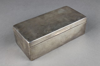 A silver rectangular cigarette box with presentation inscription, Birmingham 1919 7" 