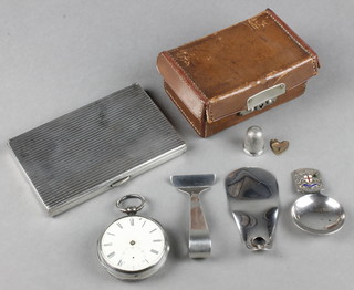 A silver caddy spoon with enamelled crest, a ribbed cigarette case and minor items 