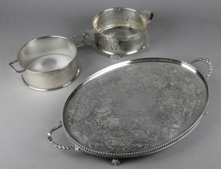 A pair of silver plated casserole sleeves and a tray