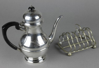 A silver plated coffee pot and toast rack