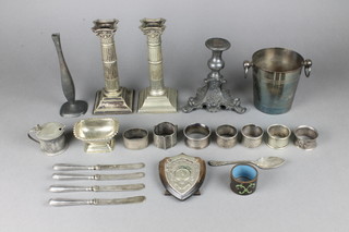 A pair of silver plated Corinthian dwarf candlesticks and minor plated items 