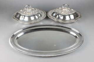 A pair of silver plated serpentine entree sets and a ditto tray 