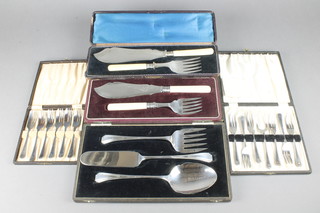 A cased silver plated fish server pair and 4 other silver plated cased sets