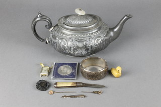 An Edwardian soft metal teapot, a silver bangle and minor items