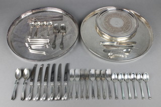 An Edwardian silver plated chased card tray, 2 other trays and minor cutlery