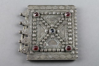 A 19th Century Indian white metal repousse case with gem set decoration 