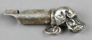 A novelty silver plate whistle in the form of a hounds head 