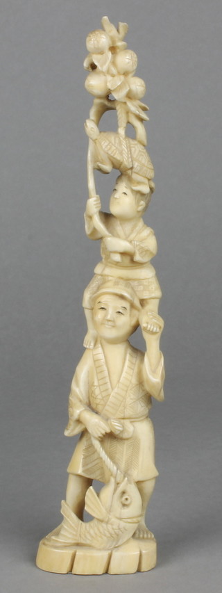A 19th Century ivory Okimono of a man with a boy on his shoulders and with a turtle on his head 8 1/4" 