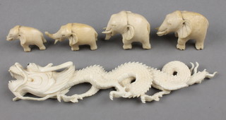 A Japanese ivory carving of a dragon 7" and 4 carved elephants