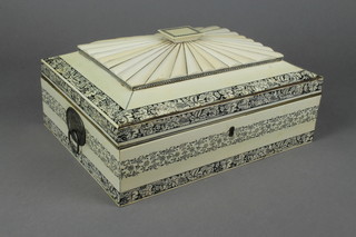 A 19th Century Anglo Indian ivory sewing box, the hinged lid revealing a well fitted interior decorated with scrolling flowers 5" x 12 1/2" x 9 1/2" 