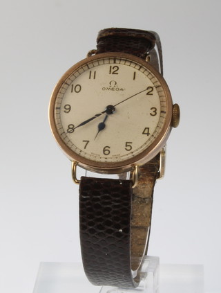 An early 20th Century 9ct gold gentleman's Omega wristwatch on a leather strap, 32mm diam. 