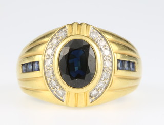 An 18ct gold gentleman's sapphire and diamond signet ring, size W, 