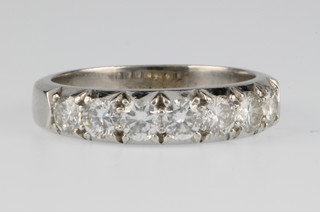 A platinum 7 stone diamond half eternity ring, size Q 1/2