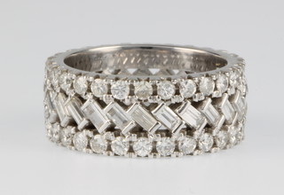 A white gold fancy diamond open eternity ring, 6 grams, size J 