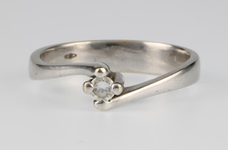 An 18ct white gold single stone diamond ring, 4 grams, size O