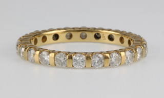 A yellow gold diamond eternity ring, size J