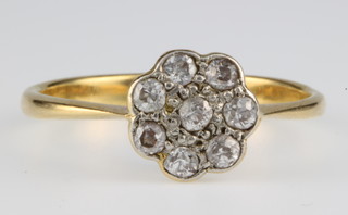 An 18ct gold diamond cluster ring, size S 1/2