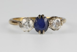 An 18ct yellow gold sapphire and diamond 3 stone ring, the sapphire approx 0.5ct flanked by 2 diamonds approx 0.5ct, size J