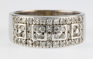 An 18ct white gold diamond half eternity ring, size N 1/2, 8 grams